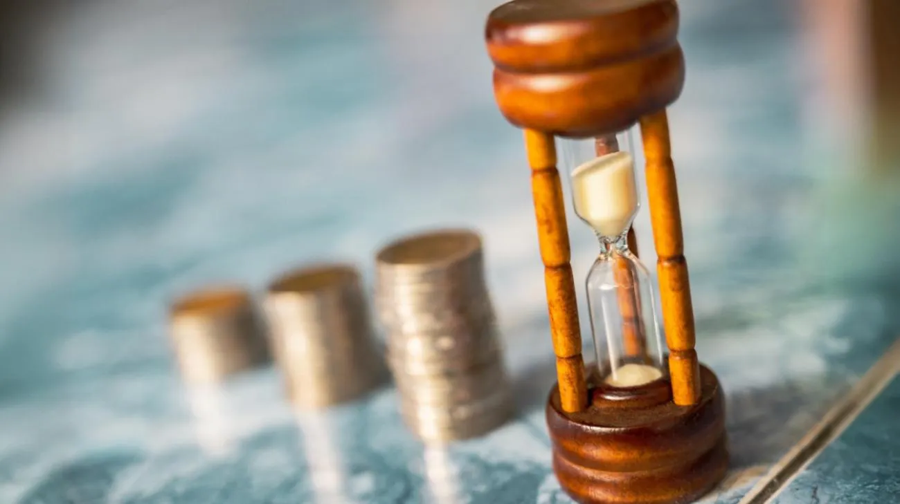 Hourglass with coin stacks