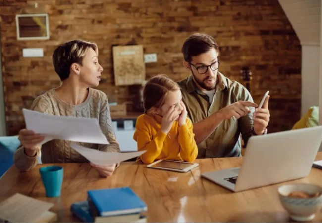 Family reviewing financial documents